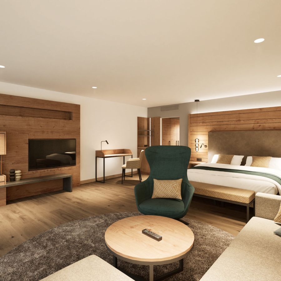 Junior Suite im Hotel Churfürstenhof mit Doppelbett, Kamin, TV und Sitzecke in warmem Holzdesign