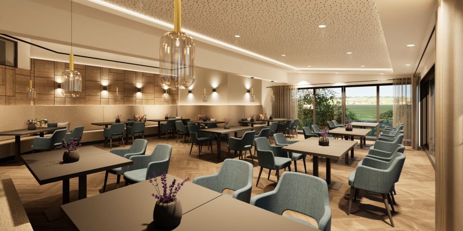 Wintergarten-Restaurant im Hotel Churfürstenhof mit blauen Polsterstühlen, Eichenparkett und Blick ins Grüne