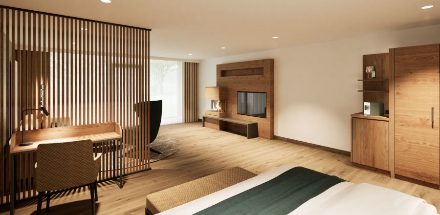 Wohnbereich der Junior Suite im Hotel Churfürstenhof mit Schreibtisch, Holzlamellenwand und TV-Board